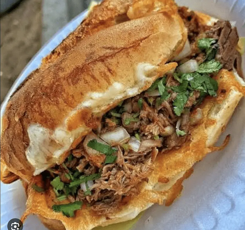 Mulitas or Tortas - Sandwich the beef and melted cheese between two crisp-fried tortillas (mulita) or load it onto a toasted bolillo roll (torta) brushed with the chili oil.