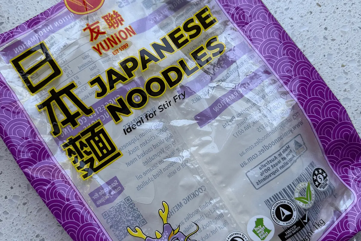 Add noodles to the pot: Add the seasoned noodles to the pot and fold through the vegetables. Warm through for a few minutes until the noodles begin to soften.