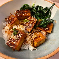 We loved this! Would definitely double the sauce so there’s more to go on the rice. I used Hodo firm tofu which is already pressed and it turned out great. Misread the directions and also sliced the block in half to make the squares thinner and would definitely do it again - I liked how crispy/chewy it got! Made a simple blanched spinach with grated garlic and sesame oil to go with it (banchan style). Easy and flavorful!