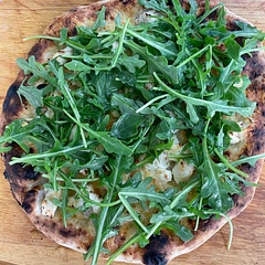 I forgot to take a picture of the dough so here’s a photo of the pizza 😂 this has been my go-to dough for six years - the 50/50 blend of all purpose and 00 flour makes it tender but also pliable. I do mix it with my hand and not with a mixer and dough hook (I find the two, three min kneading sessions a little therapeutic). I usually need a little more flour on the second kneading because it gets sticky. It’s very good after 3-4 hours but it’s EXCEPTIONAL overnight in the fridge. After a cold ferment/rise I I’ll leave it out for an hour or transfer it to the freezer for later. Everyone who has tried it always compliments it!