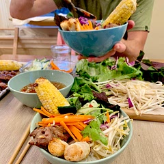 Add corn, red cabbage, bean sprouts, cucumber, and Vietnamese leafy greens