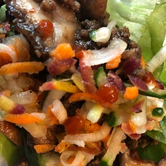 I added shiitake mushrooms, onion powder, and Chinese 5 spice to the beef, and also added, sriracha to the sauce. We garnished with carrot cucumber slaw and fresh mint and green onions out of the garden. The fresh is so good with the salty.