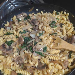 It's a bit bland, but still tasty. If you're not vegetarian I'd recommended using a bit of bacon grease and/or bacon itself to flavor the onions and mushrooms a bit more and perhaps halve the vegetable broth, subbing in a dry white wine for the other half. If using store-bought shredded parmesan, I'd recommended chopping it up a bit more with a knife to get it to incorporate more evenly, mine ended up a bit chunky.