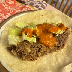 It’s a suuuper simple recipe, almost not a recipe, but softening the onion in some fat (I use olive oil) adds good flavor! I also add a tablespoon or two of my homemade taco seasoning for some spice. I use this as a filling for tacos and burritos (or even just plain!) I also make beans from scratch with Rancho Gordo pinto beans for this. So simple to make at home and is wayyy better than the can!
