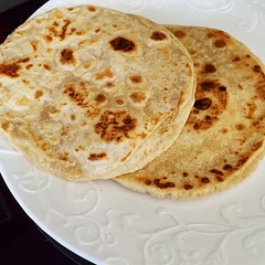 I used a Roti press, which did not get them as thin as rolling them would do, but these were great. I used Gluten Free flour and followed the directions as they were. Turned out fabulous.