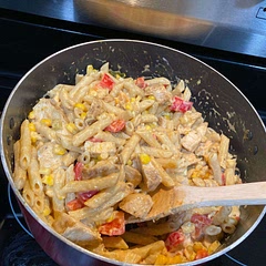 I made it and love it! I skipped the beans, because the idea of beans in pasta weirds me out. Also, I precooked 2 chicken breasts seasoned with salt/pepper/Cajun seasoning. I also did what someone else suggested and had two separate pans going. I used canned corn instead of frozen, so I tossed that in with my peppers and chilis.