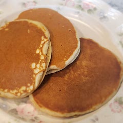 Absolutely love this recipe. I have used it for years, makes wonderfully fluffy pancakes! sometimes I will add a dash of vanilla (1tsp), almond extract(1/8tsp), or a dash of cinnamon(1/2 to 1 tsp). I also add 1/2 tsp baking soda.
*edit to add* I cook mine just above 3 on my stove. Too high/hot and you will burn them. They cook fairly quick. When the sides lose their gloss, is when I flip mine.
