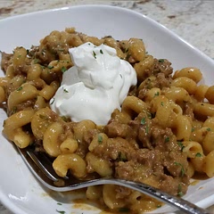 Best hamburger helper I've ever eaten. The zucchini disappears, but I love knowing it is there.  Add that little dollop of sour cream.  Takes it up a notch.  So good.