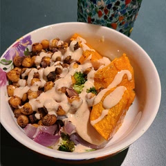 This was really delicious. I used all of the spices except the turmeric. I had never had tahini before, so I wasn't sure how I'd enjoy it, but it really added wonderful flavor to all the veggies. Next time I would double the amount of onion and maybe add some more chickpeas. The tahini sauce was plentiful so no extra needed.