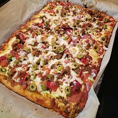 This is my go-to pizza crust, even the gluten eaters in the house love this recipe. It is a yeast based recipe, so be sure to activate your yeast with warm water (110 degrees) before adding to the mix. You will also need to let it rise in a warm place (like by the fireplace or heating element) or use the proof setting on your oven if you have one.