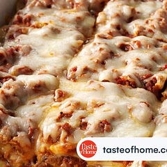 I made this lasagna for 40 guests and it was delicious, however, after tasting the sauce I felt it needed to be kicked up a notch, so I added the following to the original recipe:
2 lbs ground beef
5-8oz tomato sauce
4-6oz tomato paste
4 large garlic cloves 
3 TBSP Italian Seasoning, dried
4 cups cottage cheese
1/2 TBSP Thyme, dried
1 TBSP Oregano, dried
1 yellow onion, finely diced
4 cups grated parmesan cheese
1 extra cup of mozzarella cheese
More salt and pepper to both sauces to taste.  It was the best lasagna that I’ve ever tasted.