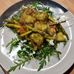 On a bed of rocket, with some ranch