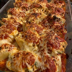 I diced and sautéed an onion, adding it to the bottom of the pan with the marinara before baking the shells.