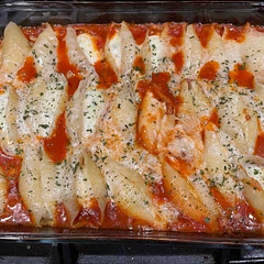 Excellent, easy recipe like most stuffed shells. I used a can of crushed tomatoes and made my own sauce but prego or whatever you prefer would also work. I used a ziplock bag and clipped the corner to fill shells.