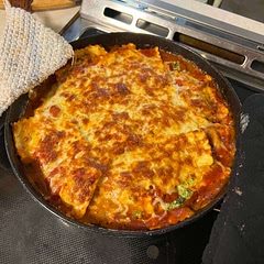 I like to add ricotta and spinach between the layers of ravioli.