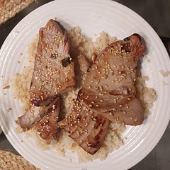 We overcooked it, so watch the tuna when you fry it. We fried it in ghee. Kinda bland. We should have reserved some of the marinate. Served with cauliflower rice, sesame seeds and lime wedges.