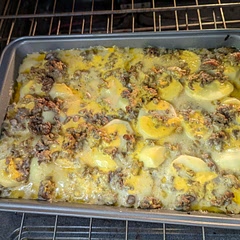 Would reduce liquid and put the last layer of cheese after removing foil in the oven.