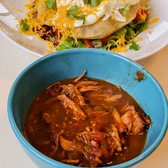 This is a lower fat, high flavor green chili.  I make this and freeze a ton of it because we use it for brunch days when I make my "Ian's huevos rancheros" recipe (also in the picture).  So delicious.