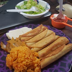 With lemon salad, sour cream, salsa, queso.