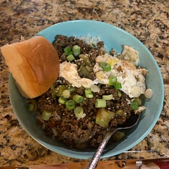 I added extra garlic, chili pepper flakes and broccoli. I topped it all off with an egg, green onions and sesame seeds. I also made a batch of extra sauce for those who like it with more.