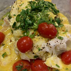 The recipe link required subscription to see the directions so I winged it.  Mix everything but the fish and tomatoes to make the sauce then pour it over the fish and roast it for about 20min or until the fish is done.