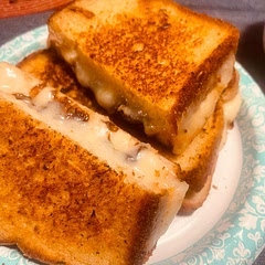 Oh so gooey decadent yumminess!  The caramelized onions and mild cheese really complemented the tomato basil soup I made tonight.  I couldn’t find sliced havarti, so we used Muenster along with the mozzarella.  I also deglazed the caramelized onions with balsamic vinegar.  I recommend a slow cook over medium-low to medium heat for grilling these sandwiches so the cheese melts through and the crust gets golden brown but not burnt.