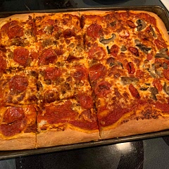 Delicious! For best flavor make it 48-72 hours before you need it. This makes a large cookie sheet of dough and is more of a Sicilian crust instead of a thinner grandmas.