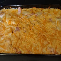 I shredded up Velveeta for the cheddar cheese. Everyone loved it. I thought I'd have leftovers, but my son ate three plates! (I also added diced ham to the middle).