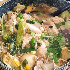 Added in mixed mushrooms, pak choi, onions, spring onions and sesame seeds to top it off. 
After straining the broth, simmering all the veg in for flavour and only one pot.