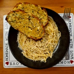 Simple but a good base sauce I would add some fish like salmon into it. I did add garlic bread to this which added a needed diffrent flavour.