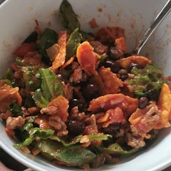 Half a romaine heart, arriba zesty taco and doritos nacho chips, tex mex cheese, old El Paso taco mix on lean ground pork (no beef available anywhere:( ) and tostitos salsa as well as beans and tomato like the recipe called for. This is absolutely delicious and i feel like tweaking things to your own taste will make this an instant favourite. Quick and easy and so, so satisfying when you want to cook but you don't wanna go crazy, yknow? Thanks for the recipe!