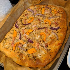 I left the dough in the fridge for about 19-20 hours, and added my own toppings (ham, red onion, bell pepper, mozzarella and parmesan) about halfway through the baking process (10 minutes with just the oil and herbs baking, then a further 10 minutes with the rest of the toppings). 
I was so impressed with this bread that I cut it into smaller pieces and took it to friends and family to demand they try! I would 100% recommend anyone try this bread with whichever toppings you like - the only important thing being the oil on top!