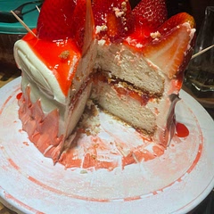 This is the best cake I’ve made in a while. The cake itself was perfectly moist it was well cooked and it didn’t taste like a box mix. The filling was easy to make, it took some time to set and made it a little difficult to decorate, there were two icing avalanches because of the filling, but it tasted very good. 
The icing was amazing. My family is evenly split. Some people absolutely love cream cheese icing and others, including me, don’t care for it. Those who aren’t fans all commented on how good it was. It wasn’t too sweet or overly cream cheesy, but there was a definite bite to the icing that could only have come from the cream cheese. The people who usually love cream cheese icing had nothing to say, so it was probably average for them. 
I served it with the extra filling in a bowl for people to top off and some extra strawberry slices. It was great.