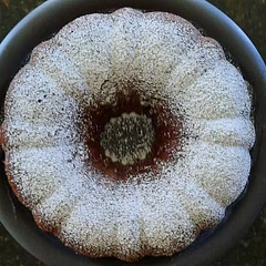 I greased and floured a Bundt style pan, and baked it for 1 hour. It came out very pretty. I dusted it with powdered sugar after it cooled.
