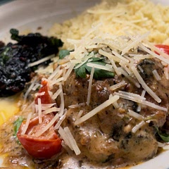 Serve with couscous and spinach. Sprinkle parmesan and parsley on top.