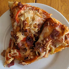 Tonight's pizza featured bacon, onion, and 3 colors of sweet bell peppers. Yum!