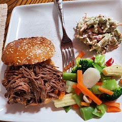 So good. I didn't have Slider buns so we used full size sesame buns.  We didn't have to slice it, we trimmed off the fat (after cooking) and it fell apart. We added a slice of raw onion to the sandwich.