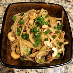 This is a tasty and easy recipe.  My partner says it could maybe use a wee bit more salt, but we agree is good without it.  Go easy on the chili flakes if you like a milder taste.  I will add cashews and sesame seeds next time.    

Things I learned while making this recipe:. How to cut spring onions.  Thank goodness for Google and YouTube.  A "nest" of pasta is about 50 grams of normal noodles (unnested?).