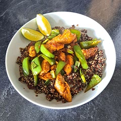 I changed this recipe a little but I think it probably made it better. I used red and white quinoa although that didn't change it much. The biggest change was that I didn't blend the green onion, cilantro etc. I cooked the chicken, added the green peppers then I added the onion and finally the cilantro for a second. The lime helped bring a zing. I didn't mix it all up together and served the quinoa seperately so it wasn't a big mess. It tasted quite nice but I'd probably swap the quinoa for wholemeal rice as I prefer it.