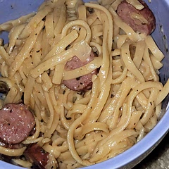 The instructions are a bit confusing, but here's what I did!

1. Start pasta water/broth (I recommend broth) to cook pasta to desired hardness. Make sure you add some salt to the pasta water, especially if you do not use broth!!
2. Cook sausage until desired crispyness (yes, this required a separate skillet, but it was so much easier this way).
2. Add garlic, onions, and tomatoes. Toss in desired spices (I added a little extra rosemary). 
3. Cook until onions are translucent or caramelized (your preference) and the skillet is fragrant.
4. Your pasta should be cooked and the liquid almost or completely gone at this point. Add pepper, salt, Italian seasoning, and rosemary to the pasta and give it a quick toss to combine.
5. Combine everything into one pot, including cheese. Add a bit more water/broth to help combine as you stir. 
6. Combine until a sauce has formed and serve hot!