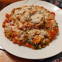 Really tasty recipe. Added a few little bits...tomato puree, paprika, Worcester sauce, chicken as well as vegetable stock, dried mixed herbs. I don't have a blender so just chucked in the can of tomatoes half at the start and half halfway through. Cooked lovely. Stirred through half the parmesan with the basil. Topped with some of the rosemary. Lovely!
