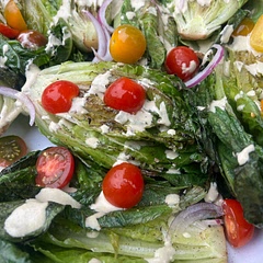 Add sliced red onion and halved cherry tomatoes