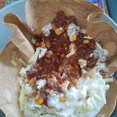 I did it in a tortilla bowl. Didn't have peppers but it was good without. Cook this in advance as it takes ages. Tasty though