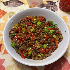 Cooked with vegetables, turkey instead of beef, and topped with green onions, pickled ginger, rice seasoning and sriracha.