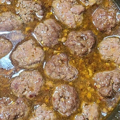 I made these with ground venison instead of chicken. I added about 10 minutes to the baking time because meatballs didn't appear done after 20 minutes.  Tripled the sauce to serve over rice.  The hubby loved it.