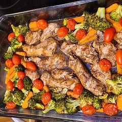 Followed recipe but used one head of brocolli instead of two which was perfect. Granted, it was a fairly big one and yielded about 2.5 cups. Marinade time was 30 mins.
GE electric oven at 400 and an altitude of around 5500. Cutlets were 1/2" average that I cut from fresh breast. Ran the vegetables 10 mins, pulled it out, put in the chicken and tomatoes, and did 15 mins. This was the PERFECT time combo. Chicken was cooked but moist. Tomatoes became sweet and were mushy (not in a bad way) on the inside but the skins stayed pretty well intact. Everyone's different but it worked great for us. Huuuuge fan of all vinegars, especially balsamic, so this was especially great.
Be aware of the high sodium content in the Italian dressing... I wasn't thrilled about that part, but I had been pretty low for the day so I had wiggle room.
Timing was perfect for easily being able to clean as you go so by the end there wasn't another big chore to do. It all comes together quickly too which makes it great for those times you need to put something together fast.