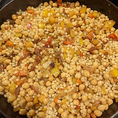 Very tasty! I didn't have regular couscous or the red peppers so I used pearl couscous and sweet cherry peppers. The combination of spices is delish!