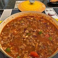 Made according to recipe. In addition, added 1/2 lb Italian sausage and extra chili powder. Served with grated cheddar cheese and sourdough bread.