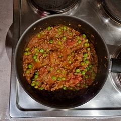 Doubled the spices, used frozen peas. Served over rice. Very tasty mince dish.
