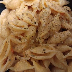 I used a red and orange pepper as that's what I had. Added more garlic for sure, and extra parmesan. It changed the color but that doesn't matter because it came out DELICIOUS. Definitely adding this to the weekly menu.